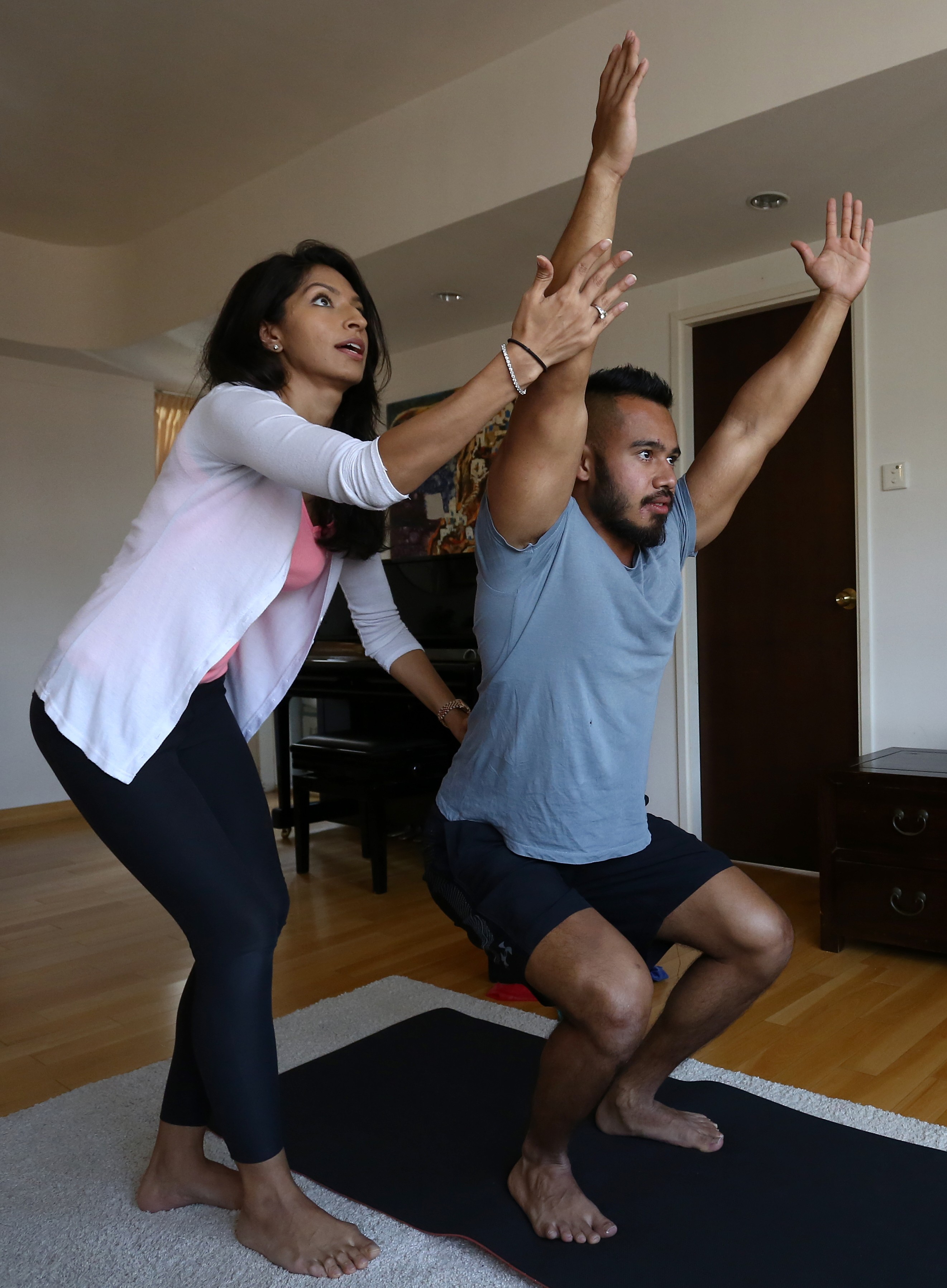 Neelam Harjani, a trader at a bank before she quit to set up Inspire Yoga, says she found yoga was an antidote to stress at work. She now leads classes to help those looking for calm and relief from busy lifestyles. Photo: Jonathan Wong