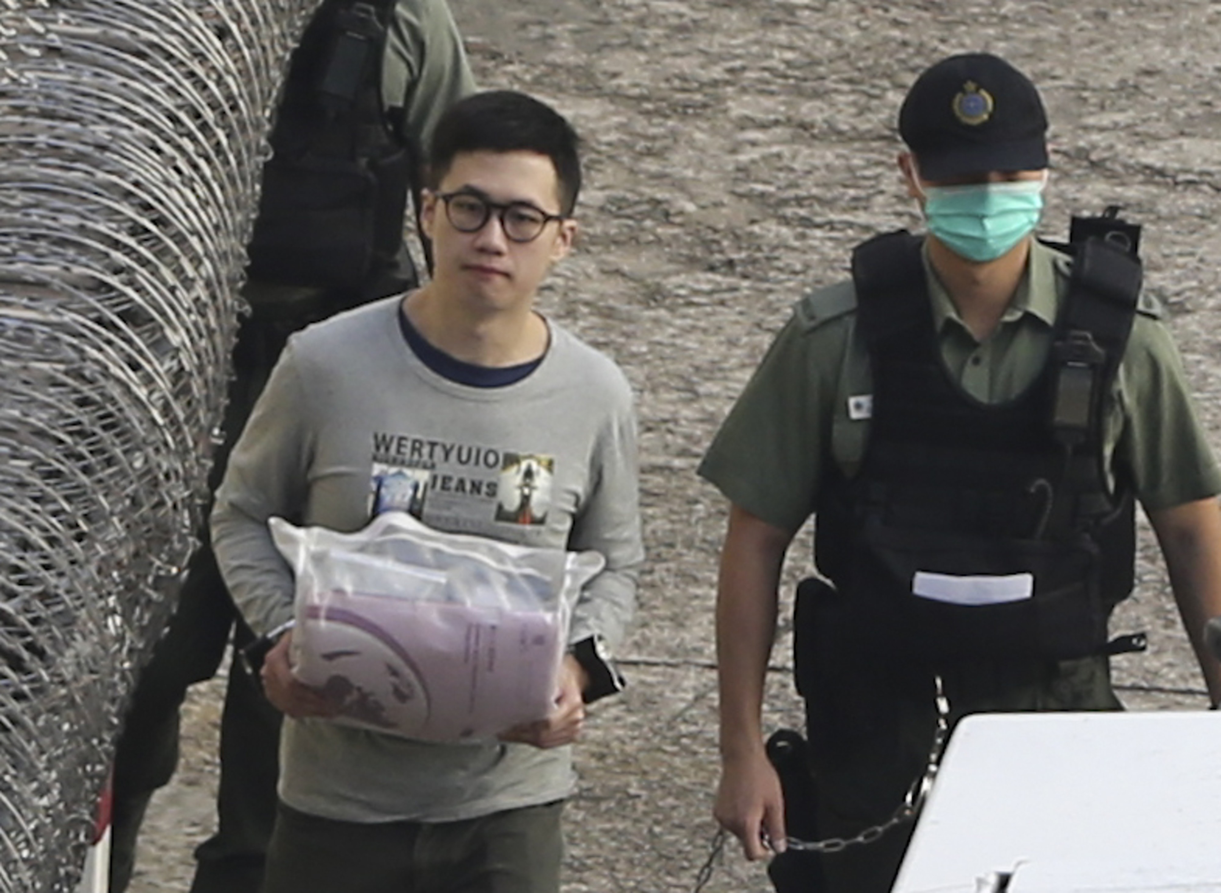 Keith Lau is escorted from the Lai Chi Kok Detention Centre in May 2018. Photo: Sam Tsang