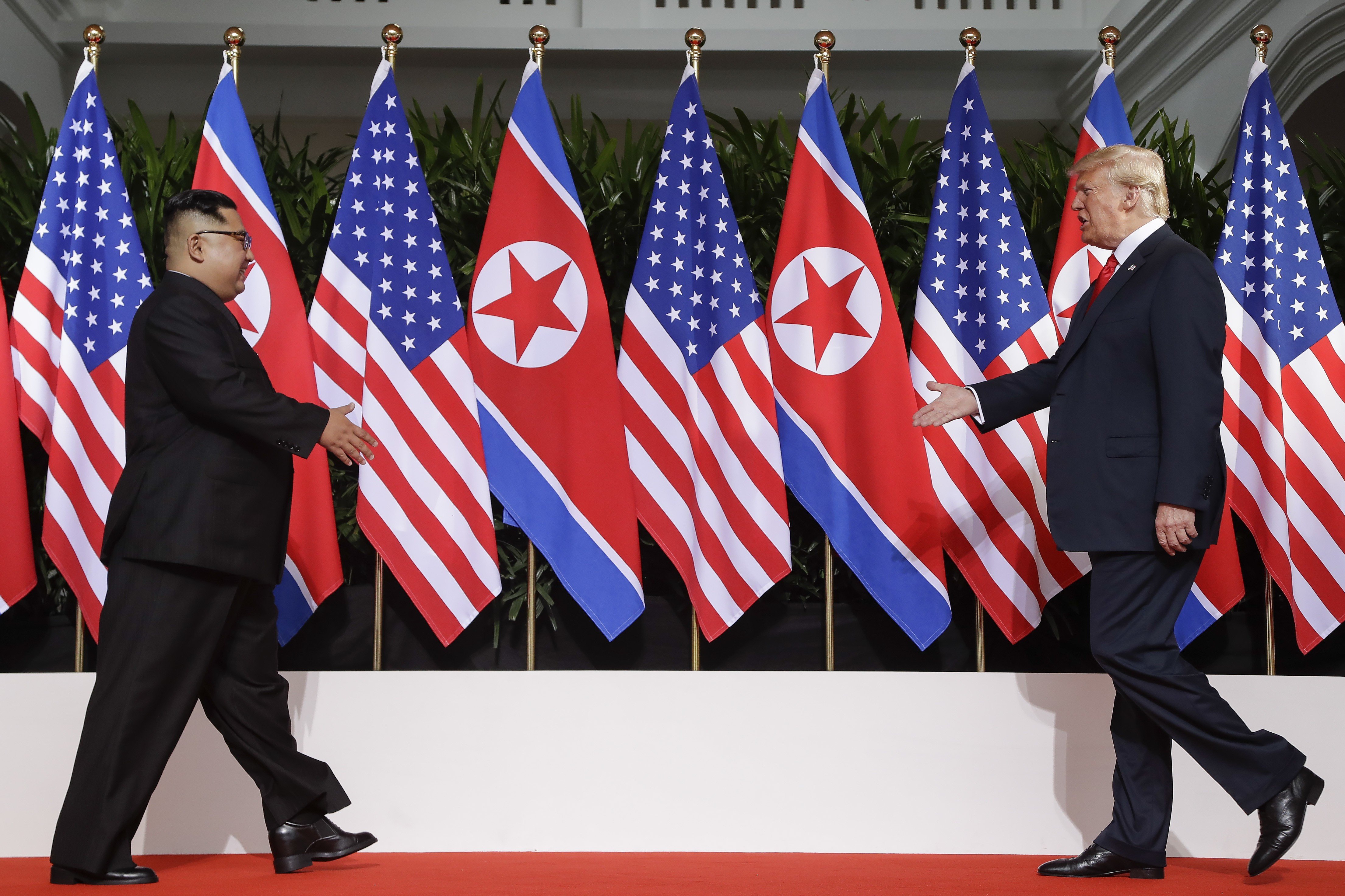 North Korean leader Kim Jong-un and US President Donald Trump greet each other in Singapore in June 2018. Photo: AP