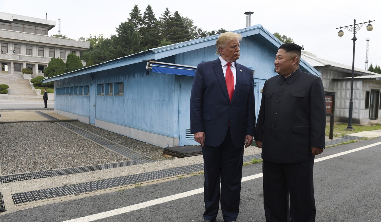 US President Donald Trump and North Korean leader Kim Jong-un meet at the border village of Panmunjom in the demilitarised zone on June 30. Photo: AP