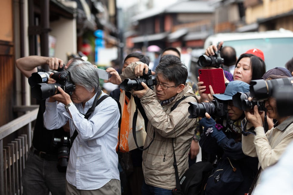 Snap-happy tourists in Kyoto’s Gion district. Photo: Shutterstock