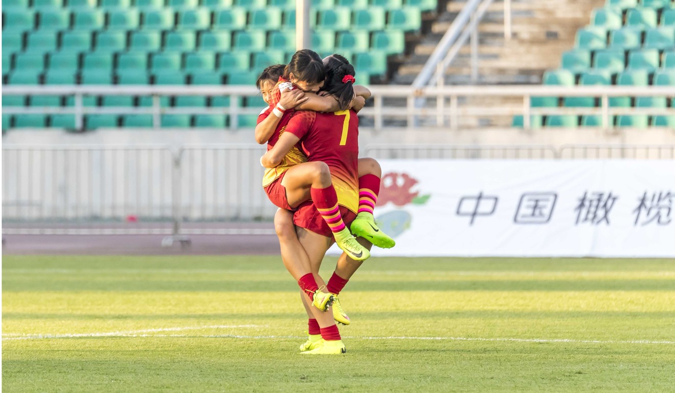 China players celebrate the win that will see them compete in the Tokyo Olympics next year.
