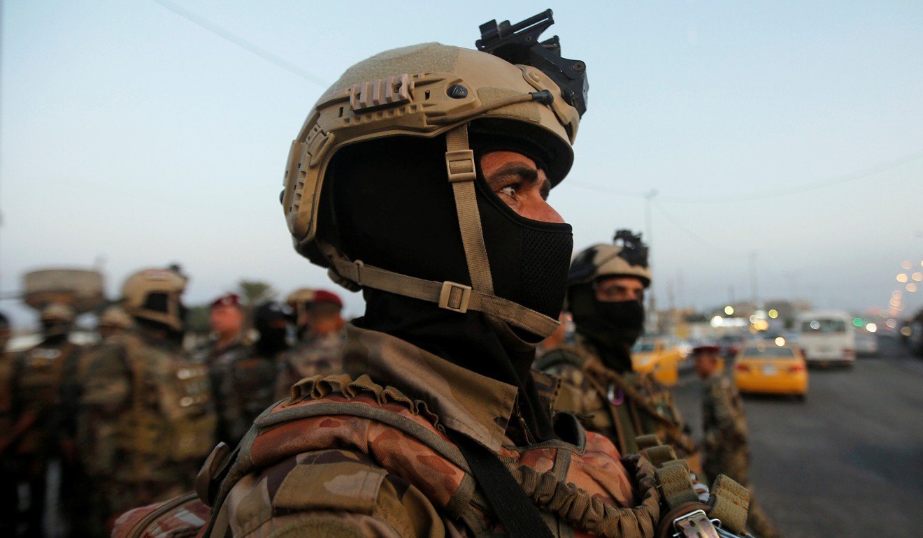 Members of Iraqi security forces are seen during the ongoing anti-government protests in Basra. Photo: Reuters