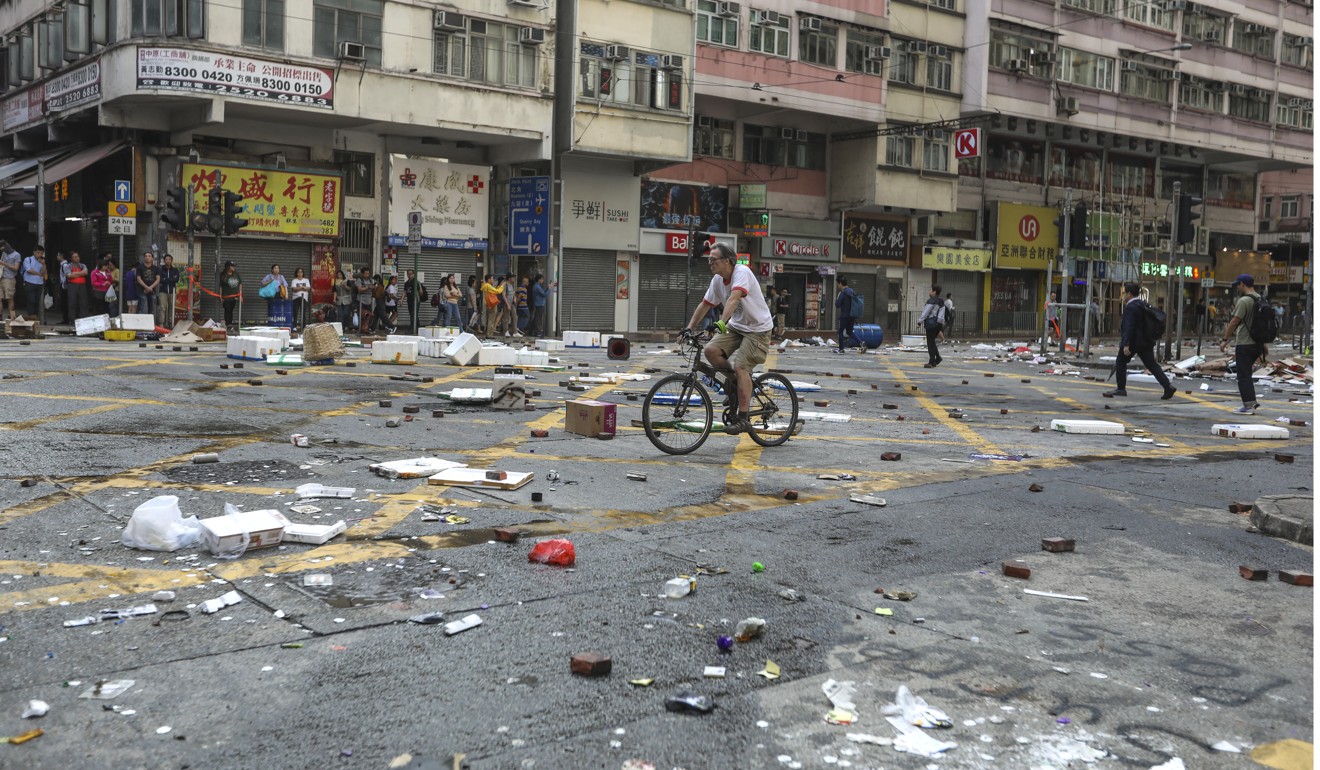 Debris covers the street in Sai Wan Ho after the shooting incident. Photo: Nora Tam