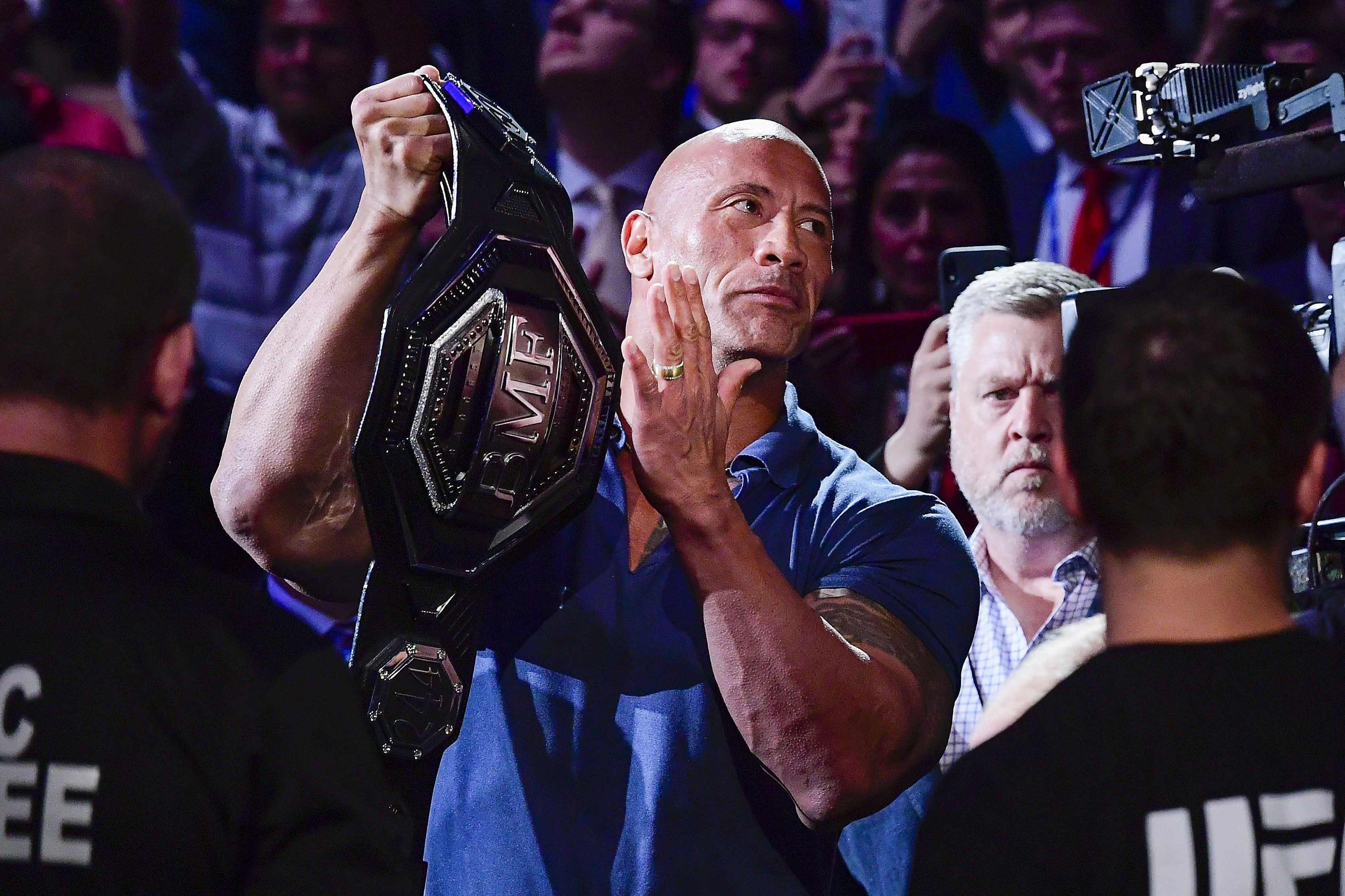 Dwayne “The Rock” Johnson holds the ‘BMF’ belt for the bout between Jorge Masvidal and Nate Diaz at UFC 244 at Madison Square Garden. Photo: AFP