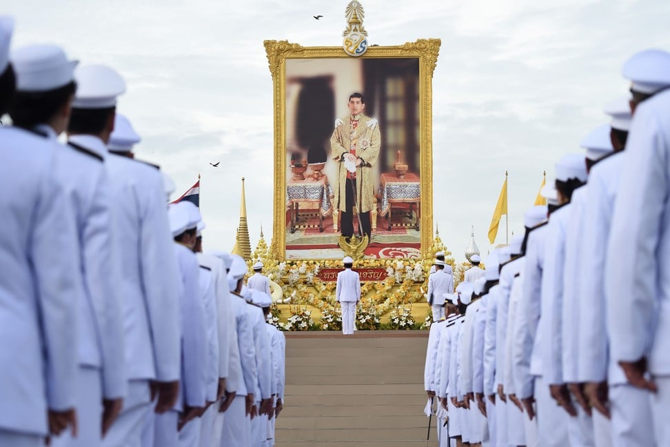 Thailand’s Prime Minister Prayuth Chan-ocha (centre) and officials salute a portrait of King Maha Vajiralongkorn during the king’s 67th birthday celebrations in Bangkok on July 28, 2019. Photo: AFP