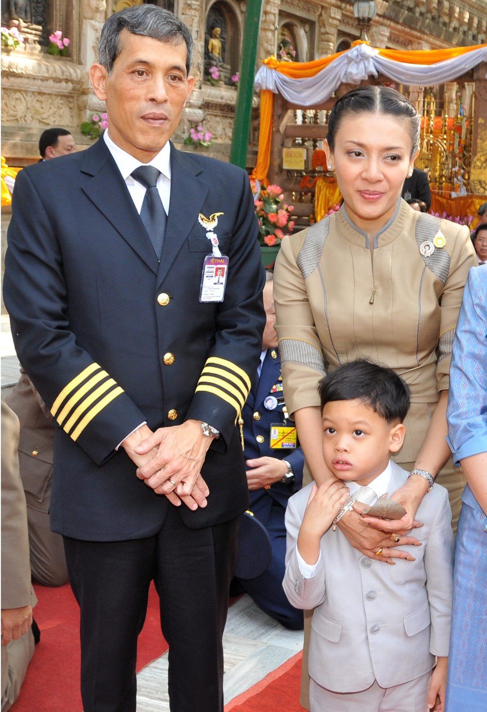 King Maha Vajiralongkorn (left) with Princess Srirasmi and Prince Dipangkorn Rasmijoti.