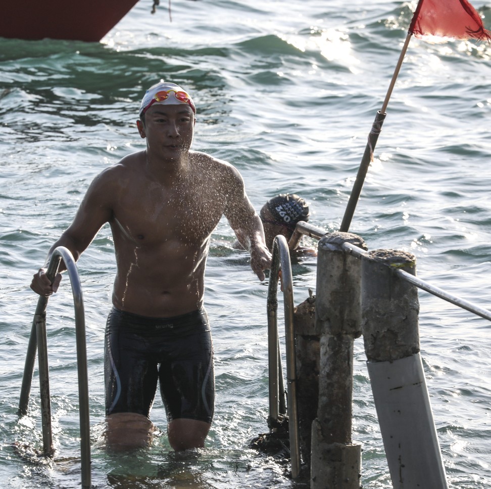 Fong emerging after 45km at the finish at Sandy Bay Swimming Shed, Pok Fu Lam. Photo: Nora Tam