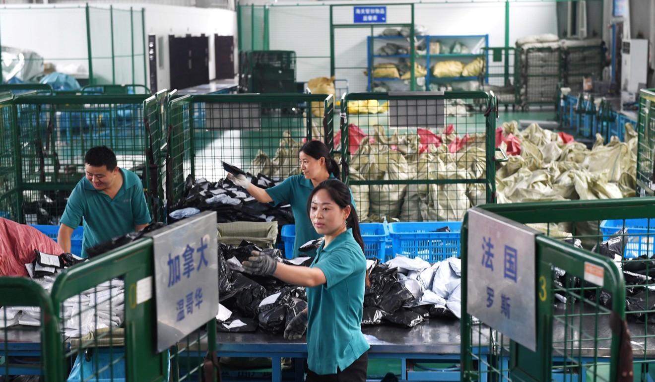 Workers sort international parcels at a cross-border e-commerce industrial park ahead of the Singles Day online shopping festival in Hefei, Anhui province, China. Photo: Reuters