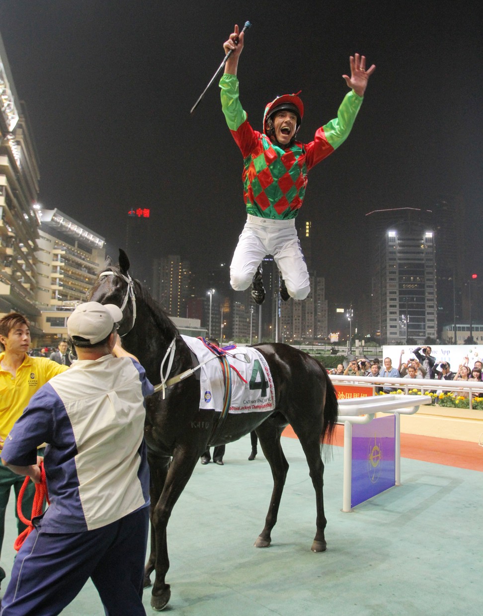 Frankie Dettori jumps in the air after winning a race at Happy Valley in 2011.