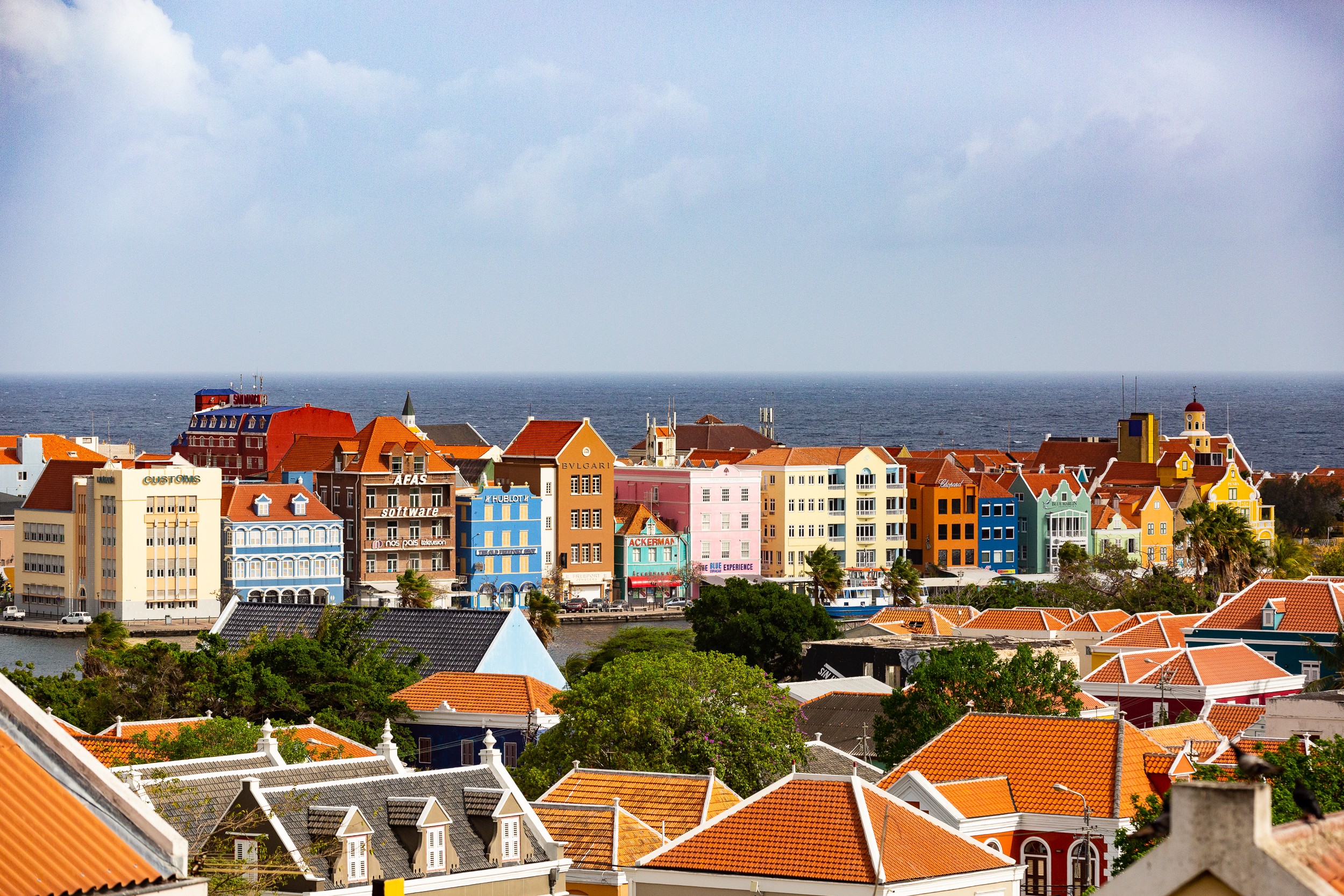 Curacao's capital, Willemstad, is known for its bright-coloured architecture, which embraces styles from the Netherlands and the Spanish and Portuguese colonial towns with which the city engaged in trade.