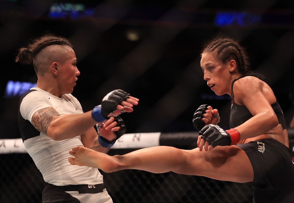 Jessica Andrade gets kicked by Joanna Jedrzejczyk at UFC 211. Photo: AFP