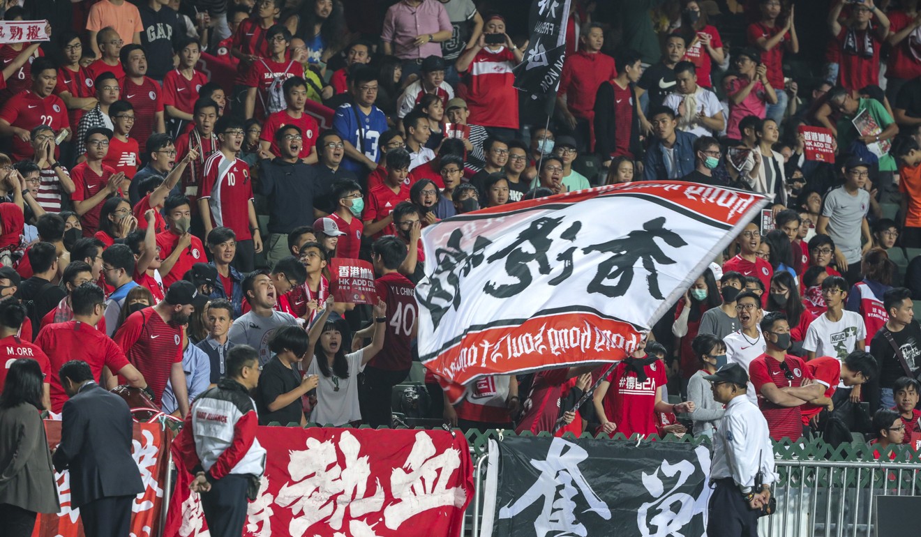 Hong Kong fans hold up signs during the match against Bahrain. Photo: May Tse