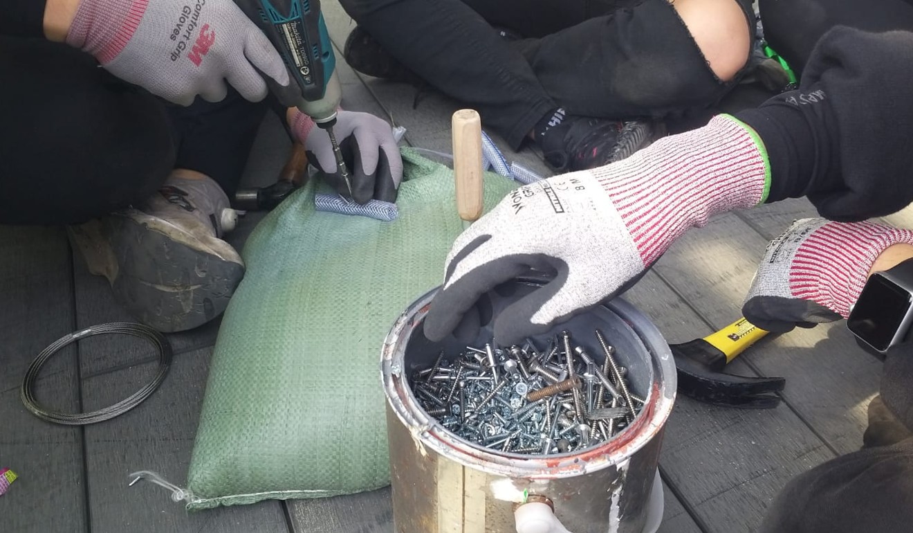 Nails for roadblocks being made at PolyU. Photo: Kathleen Magramo