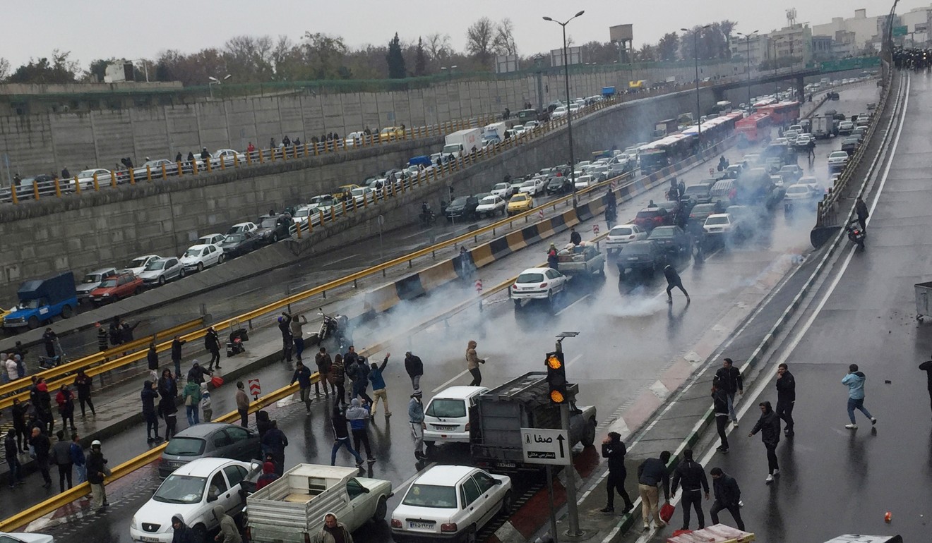 People protest against increased fuel prices, on a highway in Tehran. Photo: Reuters