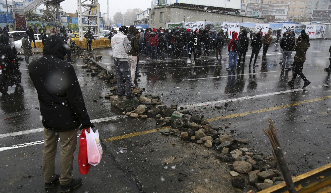 A road is blocked by protester in Tehran, Iran. Photo: AP