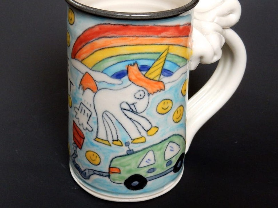 Musk tweeted a picture of Tom Edwards’ farting unicorn mug.