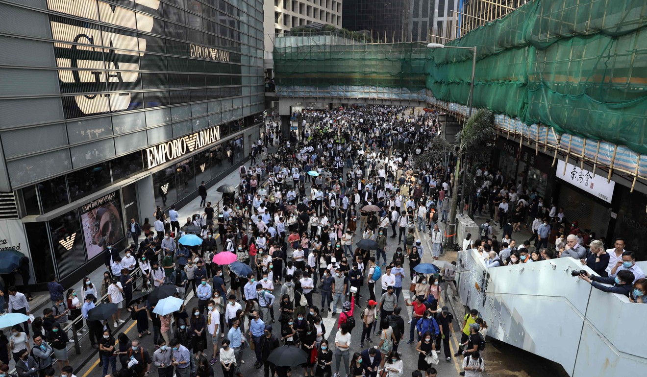 Protesters and office workers gather during a protest in the Central district of Hong Kong. Photo: AFP