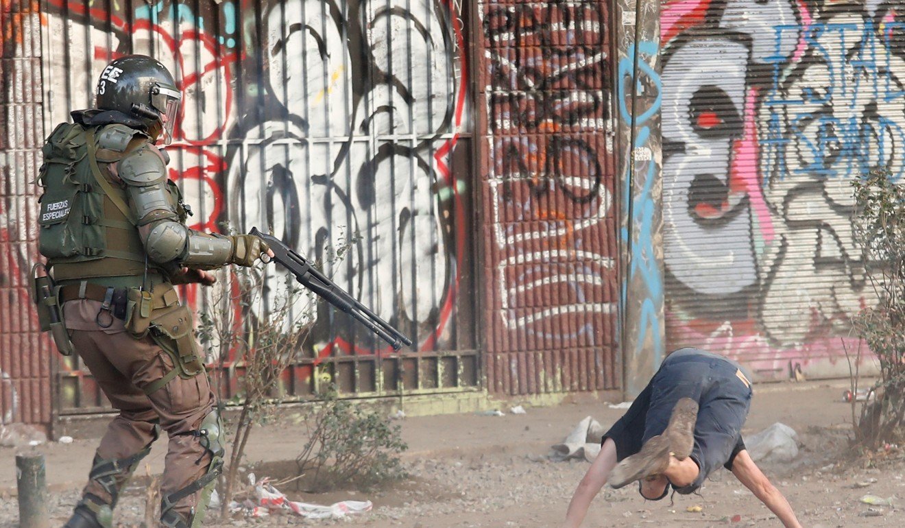 Police clash with demonstrators during a protest in Santiago. Photo: Reuters