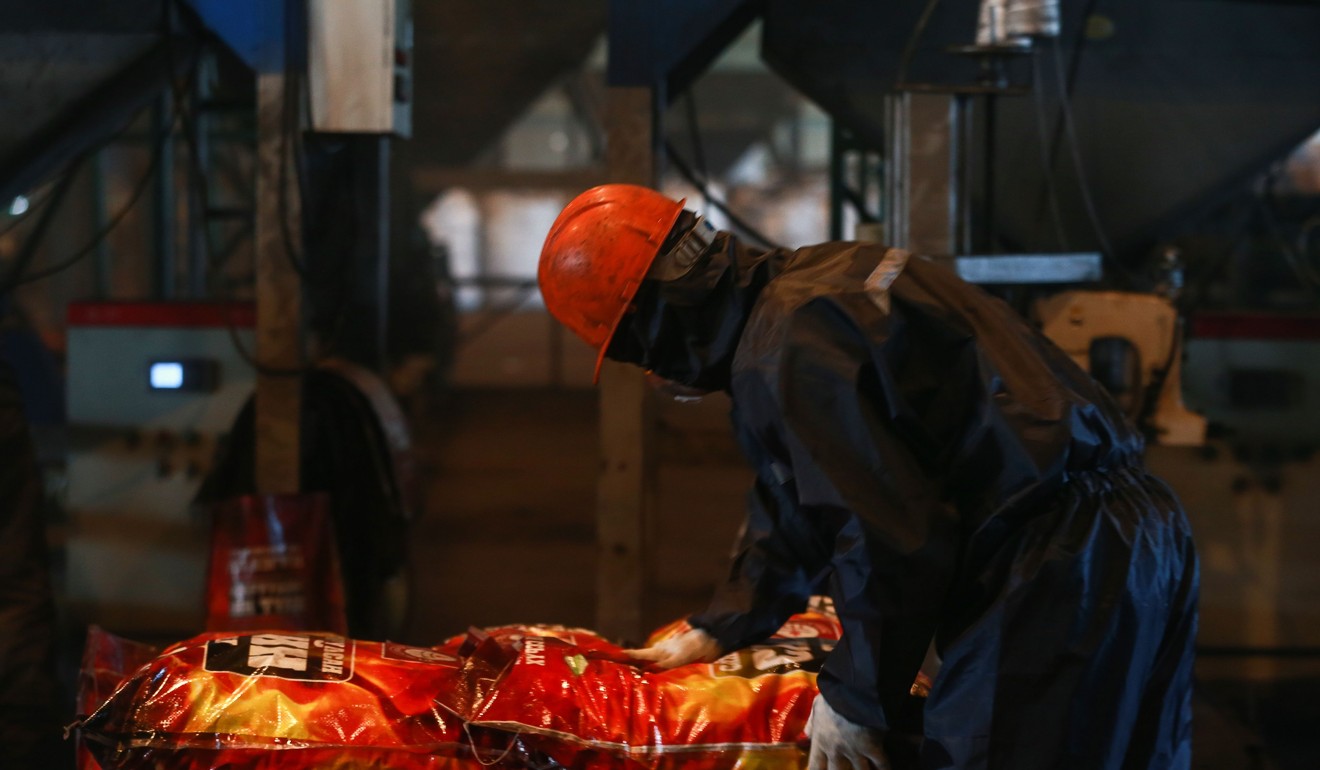 Employees at a factory producing smokeless fuel in Ulan Bator. Photo: AFP