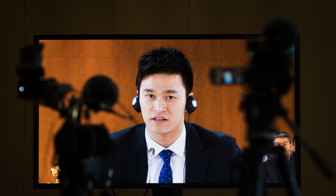 Sun Yang is seen on a video screen as he speaks during his public CAS hearing. Photo: AP