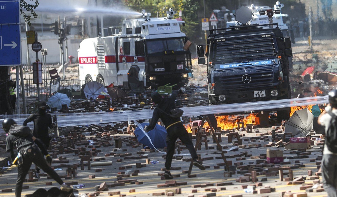 Two water canon trucks arrive to disperse protesters from Hong Kong Polytechnic University in Hung Hom. Photo: Sam Tsang