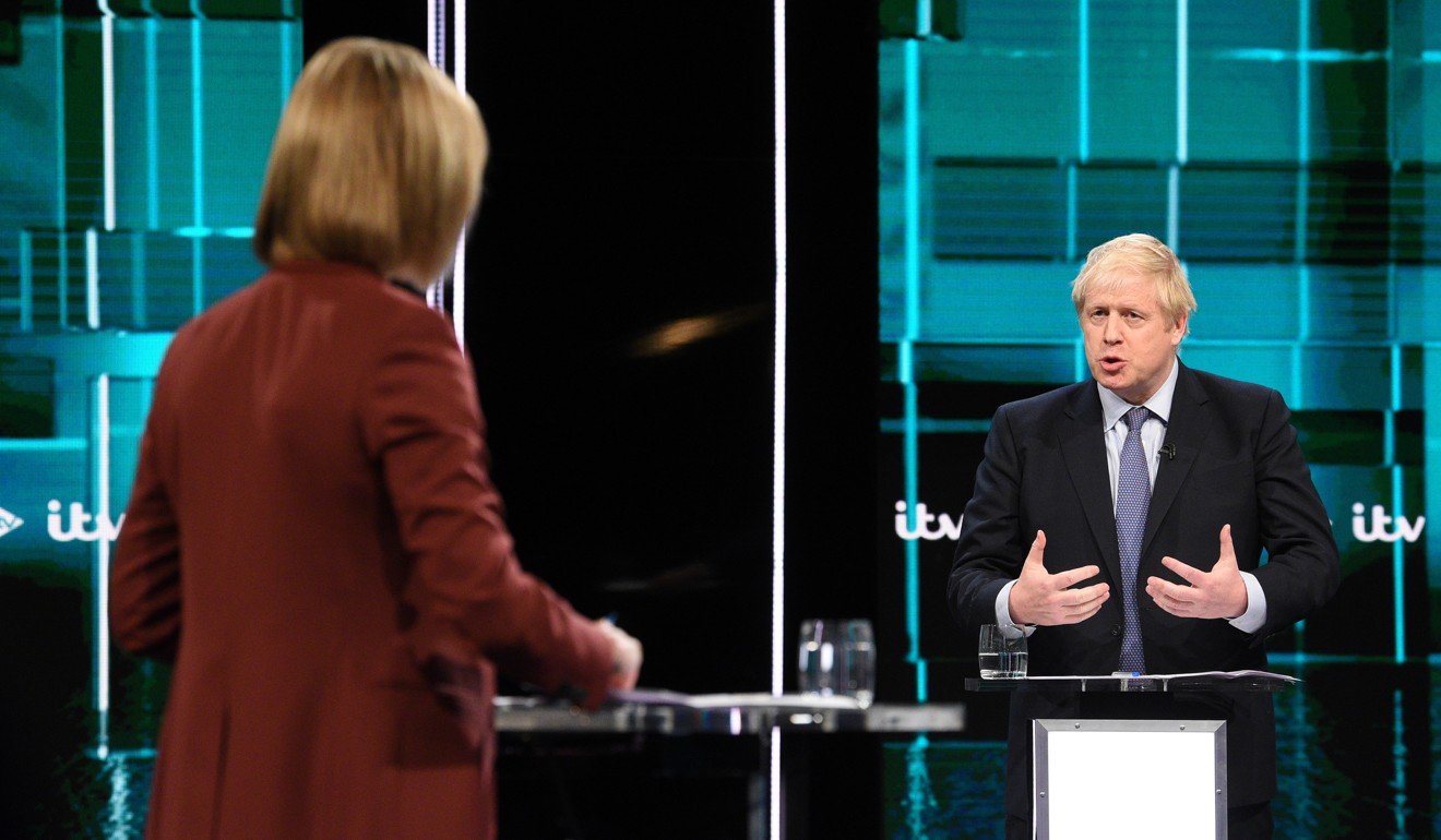 Boris Johnson and ITV journalist Julie Etchingham during the live debate. Photo: Handout via EPA-EFE