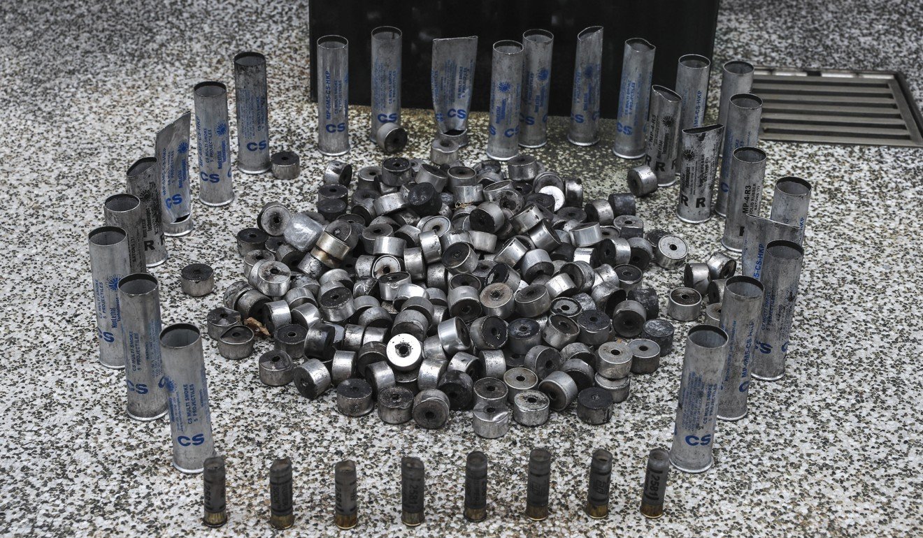 Anti-government protesters display shells of tear gas police used on them at City University of Hong Kong in Kowloon Tong. Photo: Sam Tsang