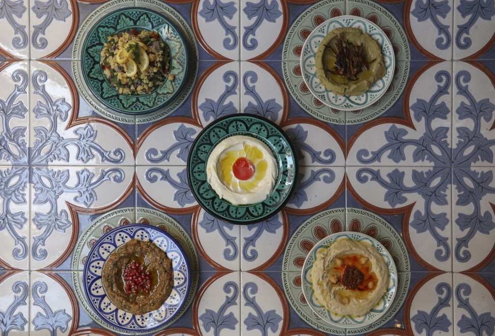 (Top, from left) tabbouleh and bosara, (centre) labna and (bottom, from left) moutabel and hummus at Aziza. Photo: Xiaomei Chen