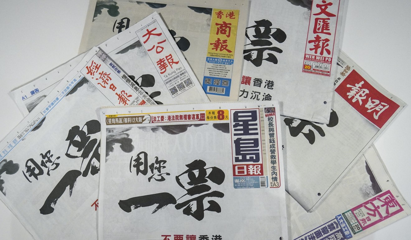Advertisements in Chinese-language newspapers calling on people to come out and vote. Photo: Roy Issa