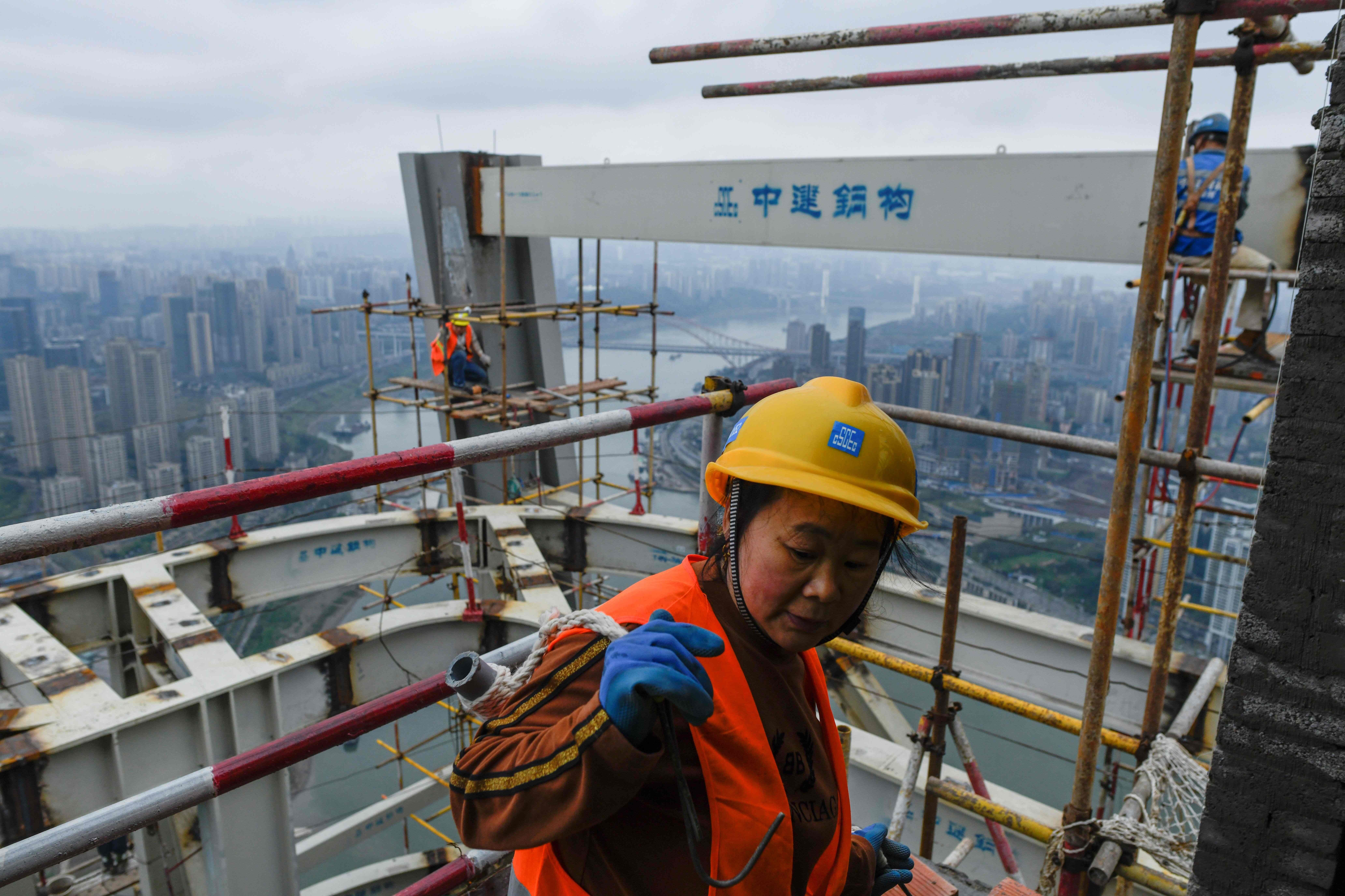 Construction workers in Chongqing, China, on March 22. The fate of China’s economic war with the US depends less on the trade deals negotiated and more on whether China can prevent a property market collapse. Photo: AFP