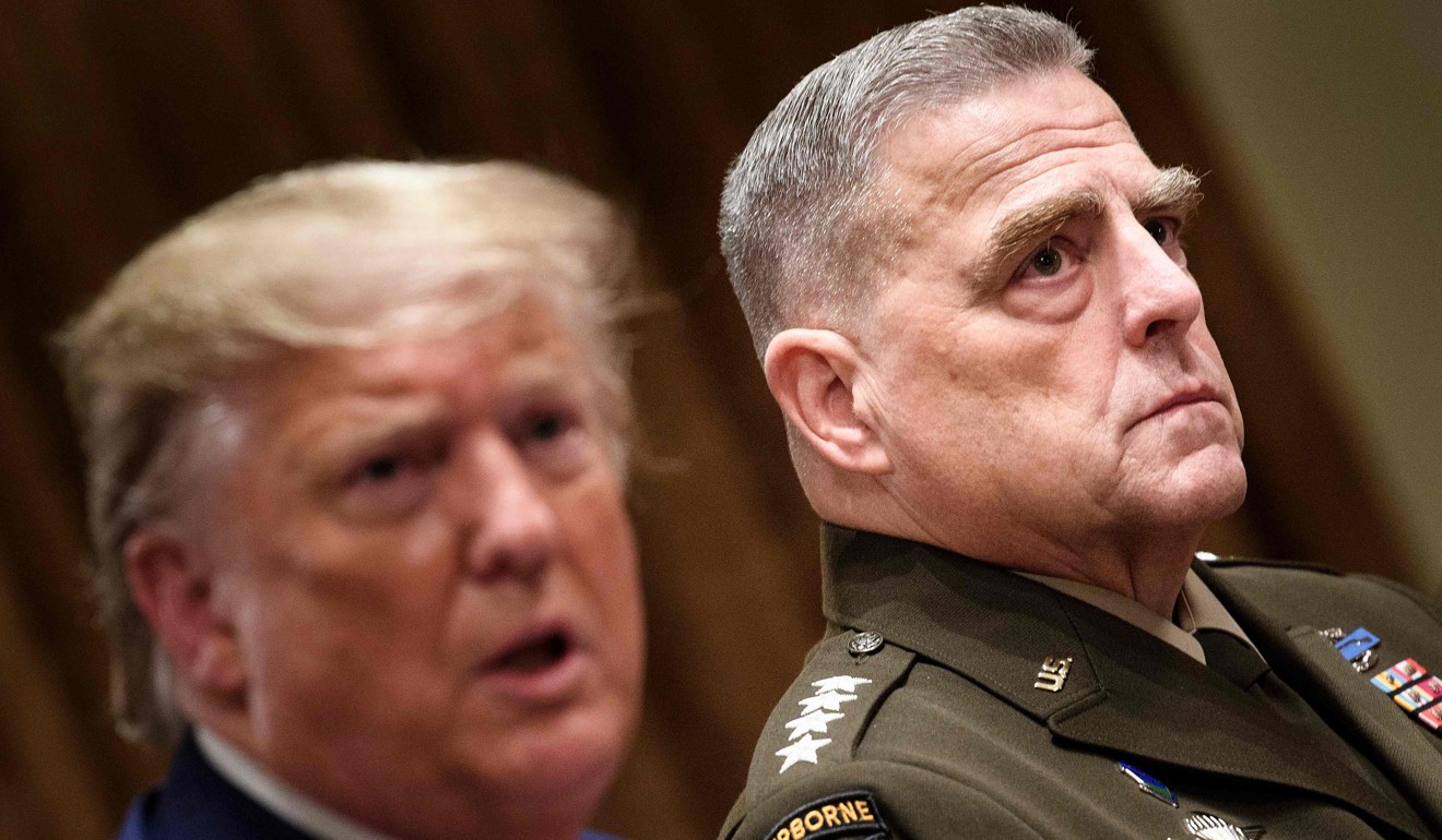 General Mark Milley, chairman of the Joint Chiefs of Staff, listens as US President Donald Trump speaks before a meeting with senior military leaders last month at the White House. Photo: AFP