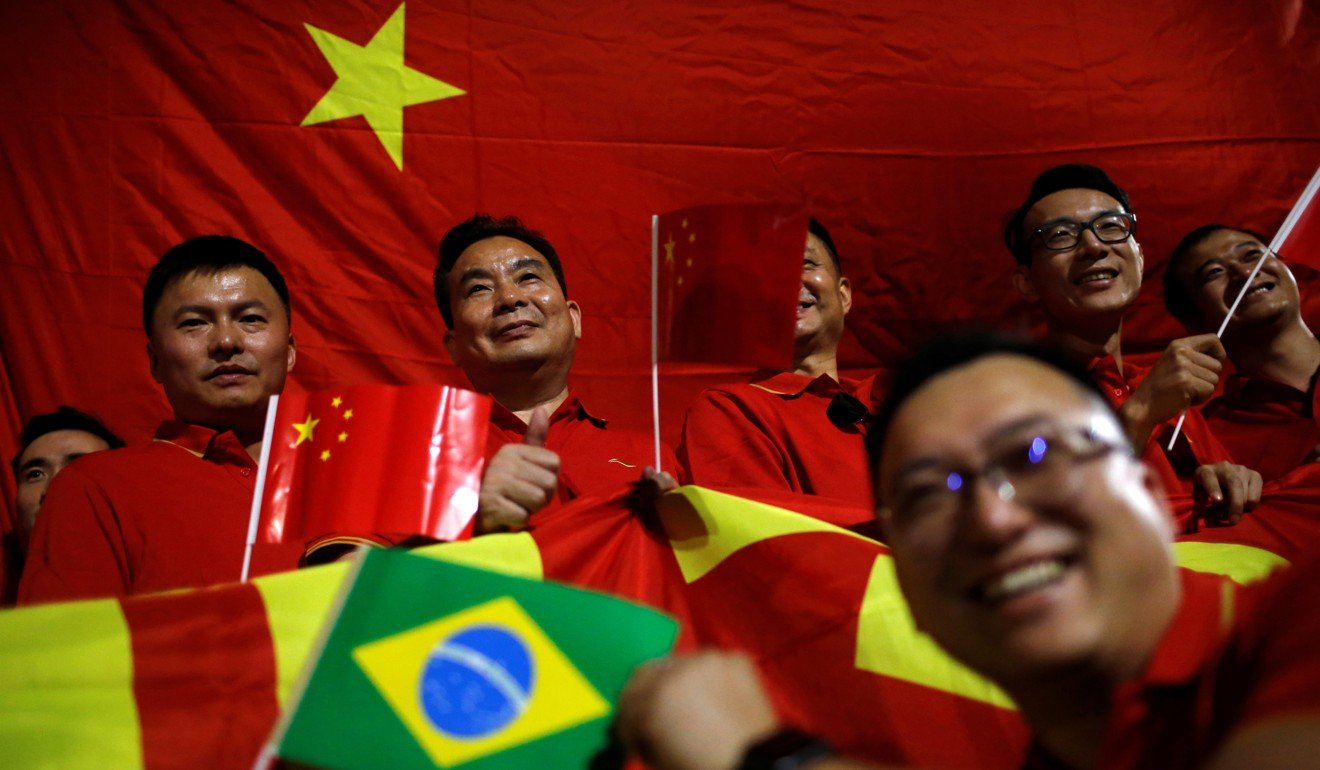 Supporters wait for the convoy of Chinese President Xi Jinping to arrive in Brasilia ahead of the BRICS summit this month. Photo: Reuters