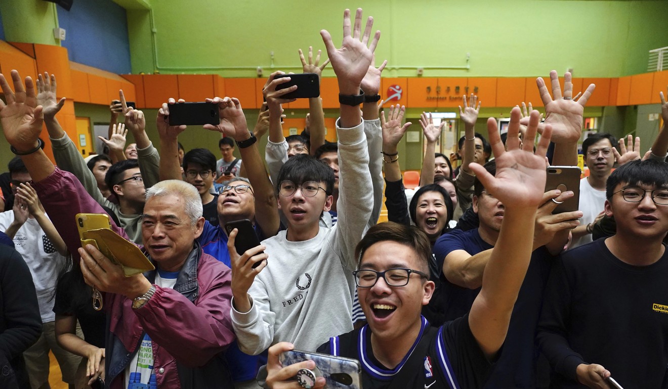 Jubilation as another pro-democracy politician wins in the district council elections. Photo: AP
