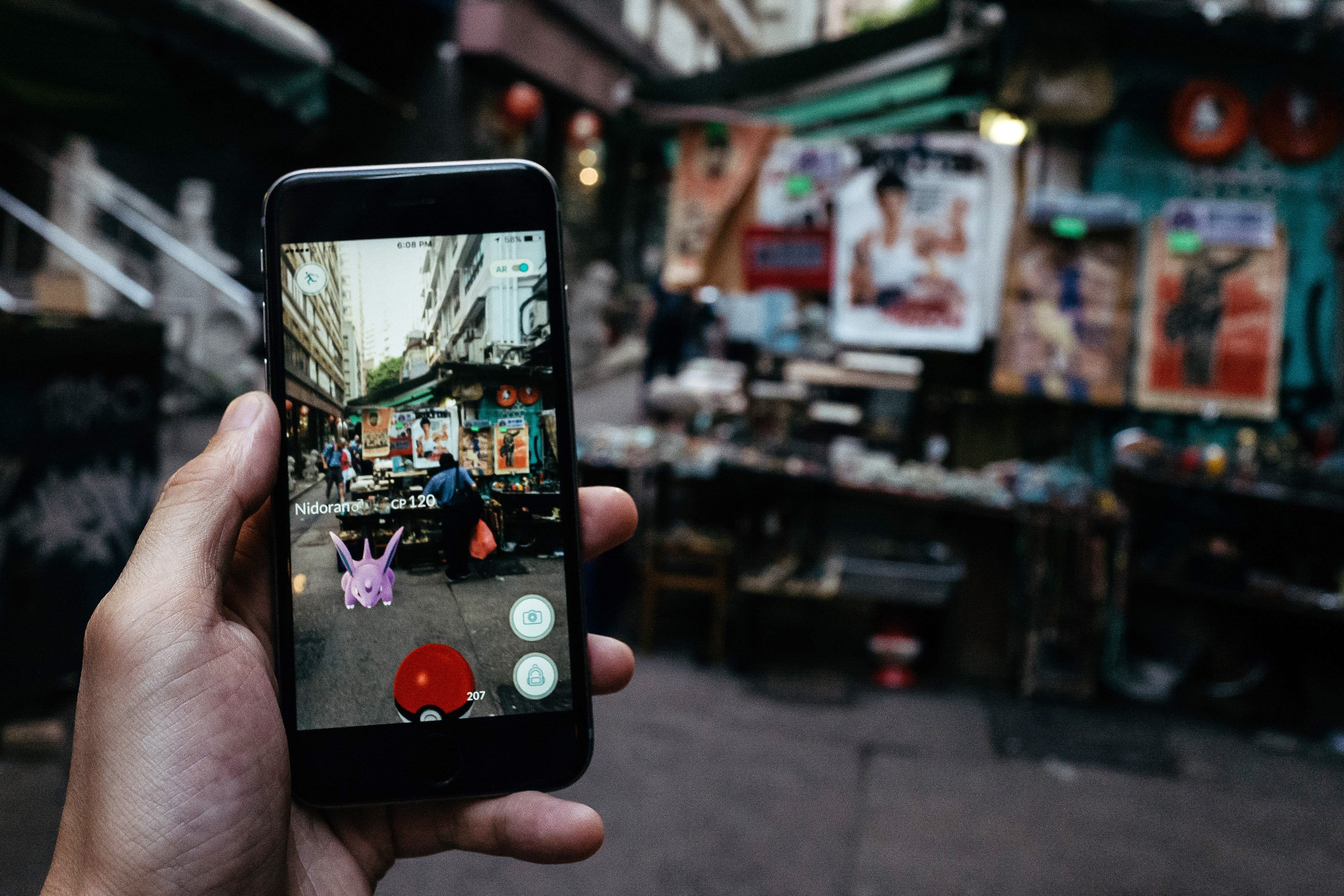 A player tries to catch the Nidoran character of Pokémon Go. Photo: Bloomberg