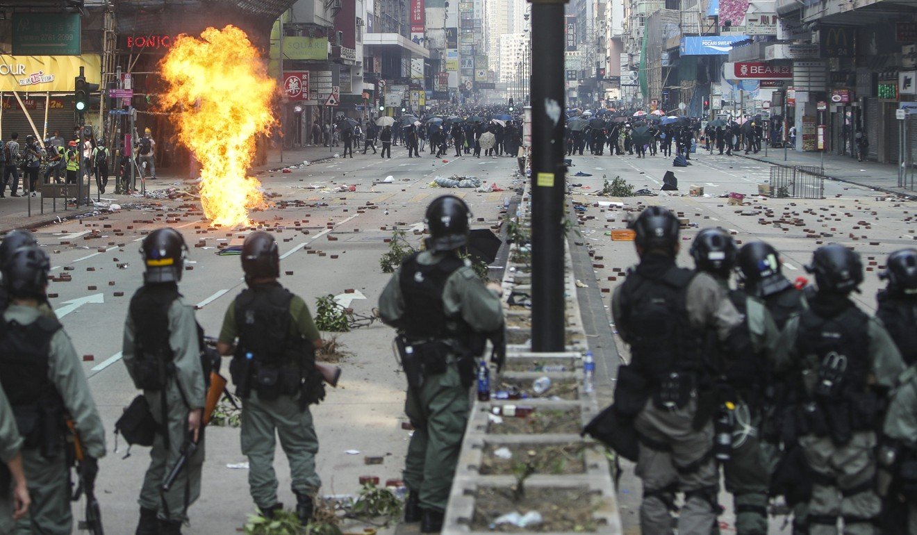 Riot police face off against anti-government protesters on Nathan Road in Tsim Sha Tsui on November 18. Photo: Winson Wong