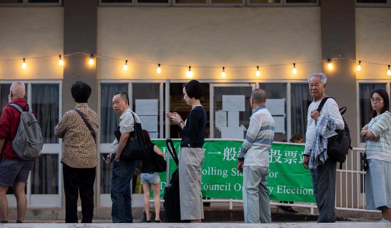 People queue up to cast their vote for the district council election in Sha Tin on Sunday. Photo: EPA-EFE