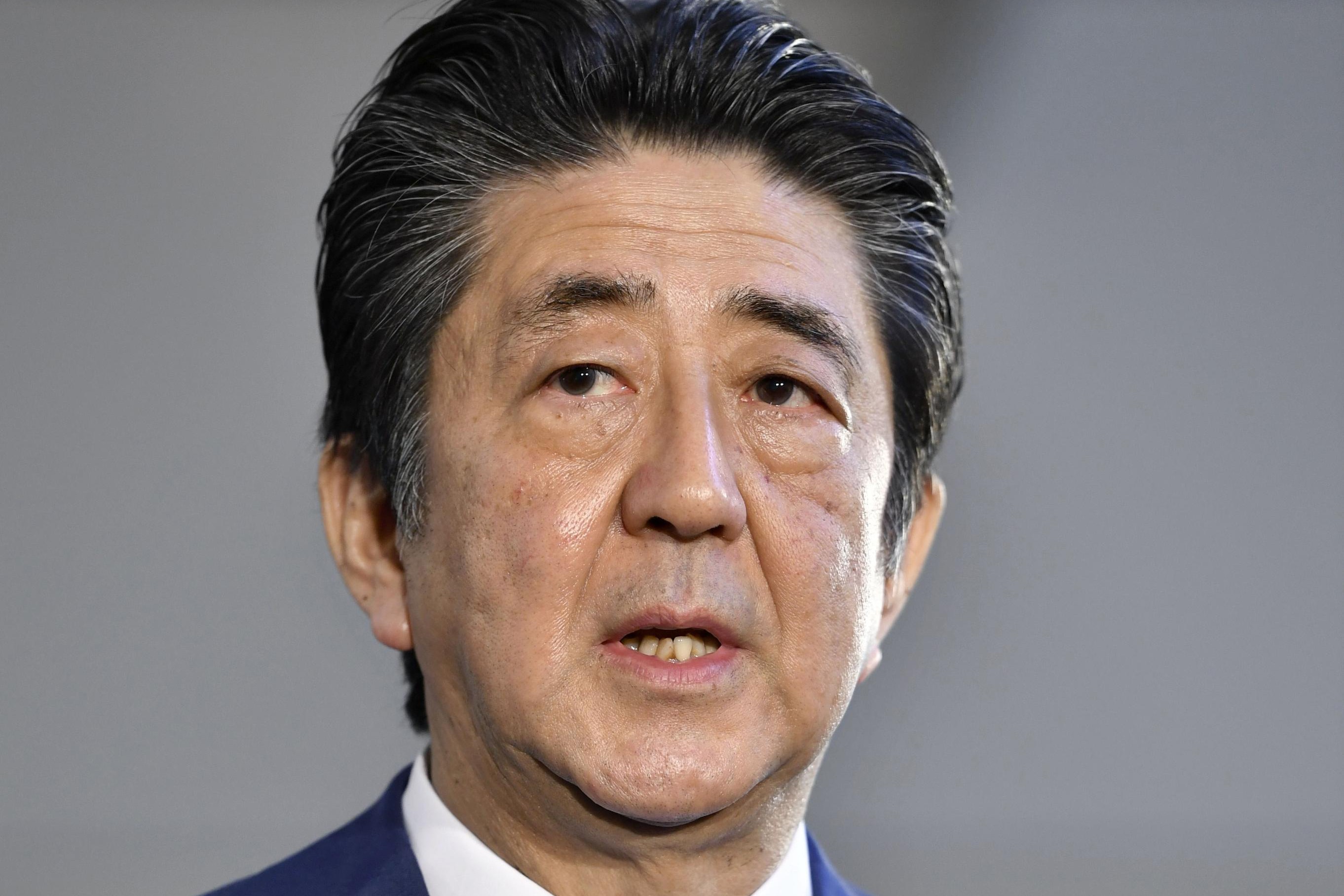 Japan’s Prime Minister Shinzo Abe staked a deflation-busting recovery on “Abenomics”, a three-arrowed strategy to promote sustainable growth through monetary, fiscal and structural policies that stimulated business investment and consumer spending. Photo: Kyodo