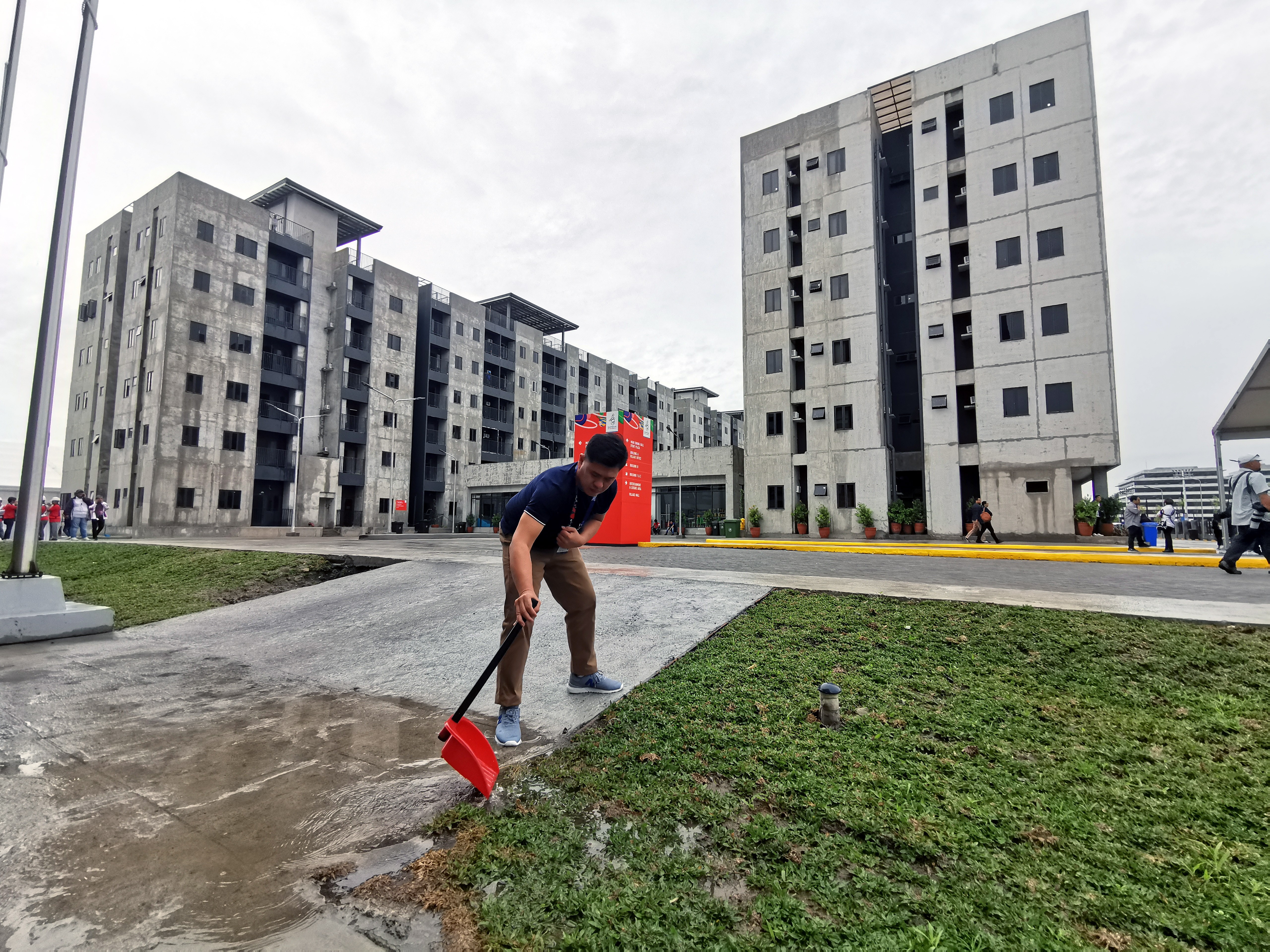 A man works in front of the athletes’ village inside the New Clark City Sports Complex for the SEA Games in the Philippines. Photo: EPA