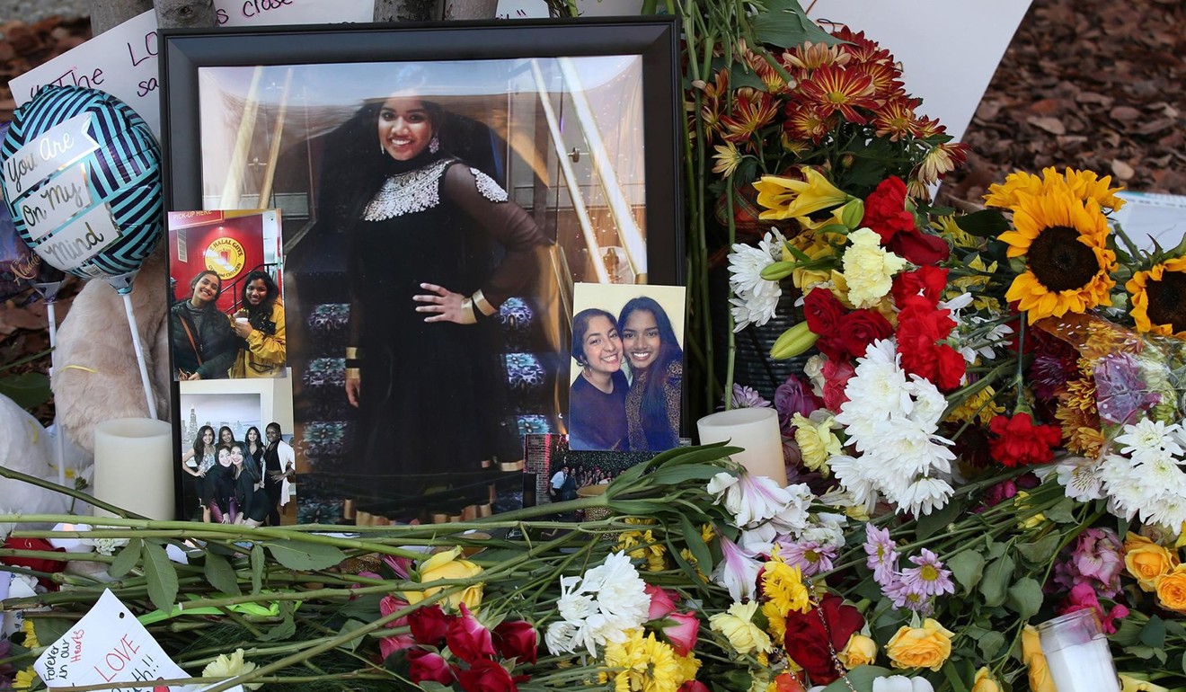 A memorial adorned with photographs, candles, cards and flowers. Photo: TNS