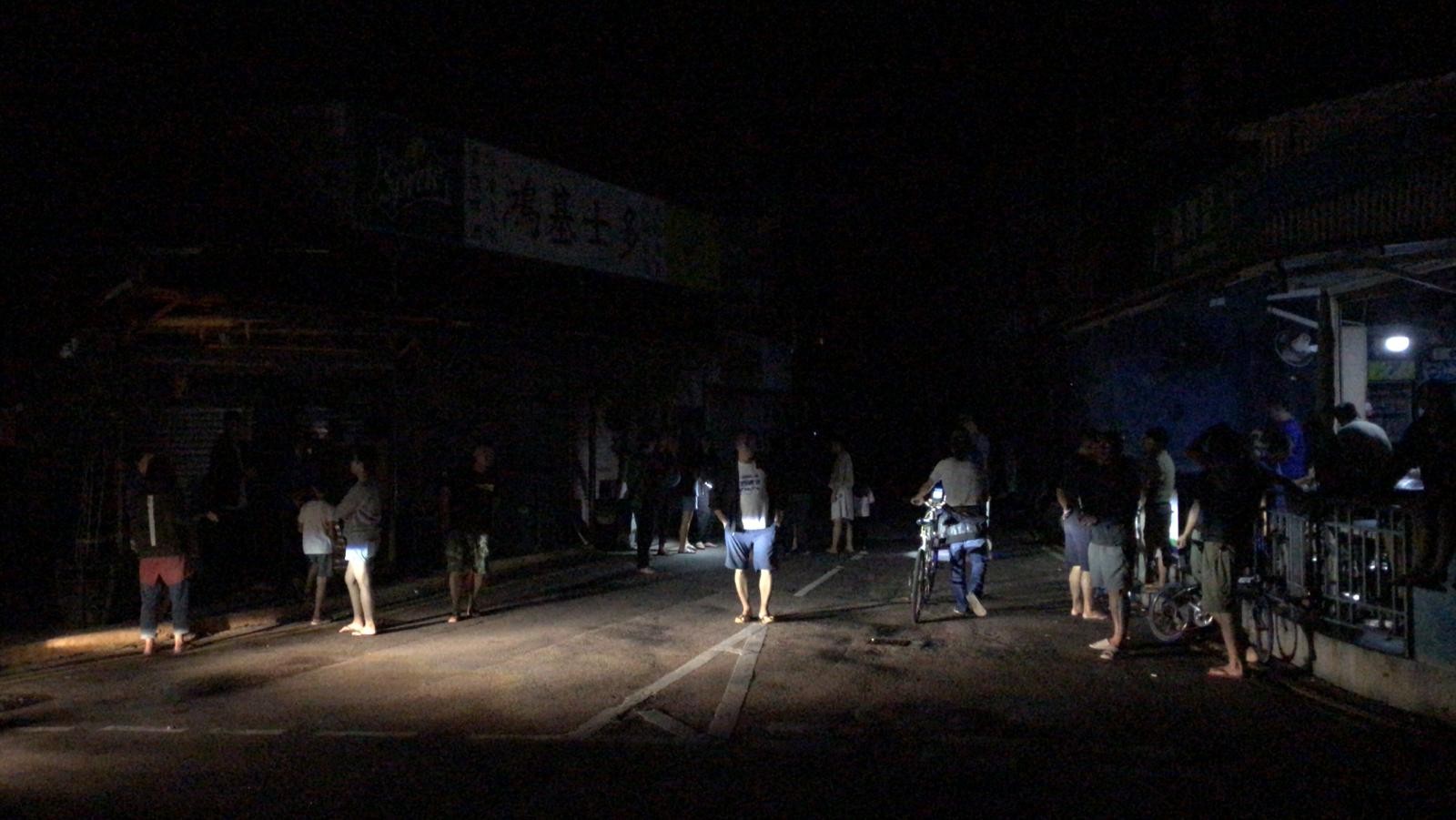 Residents in the dark amid the blackout in Shek O. Photo: Amanda Johnstone