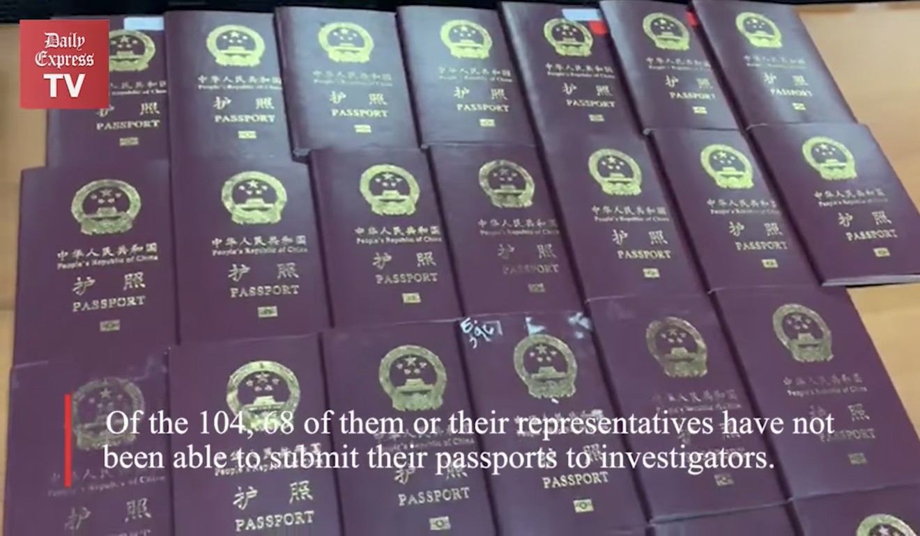 The passports of some of the 104 Chinese citizens who were arrested for their alleged involvement in an online scam syndicate. Photo: Daily Express TV