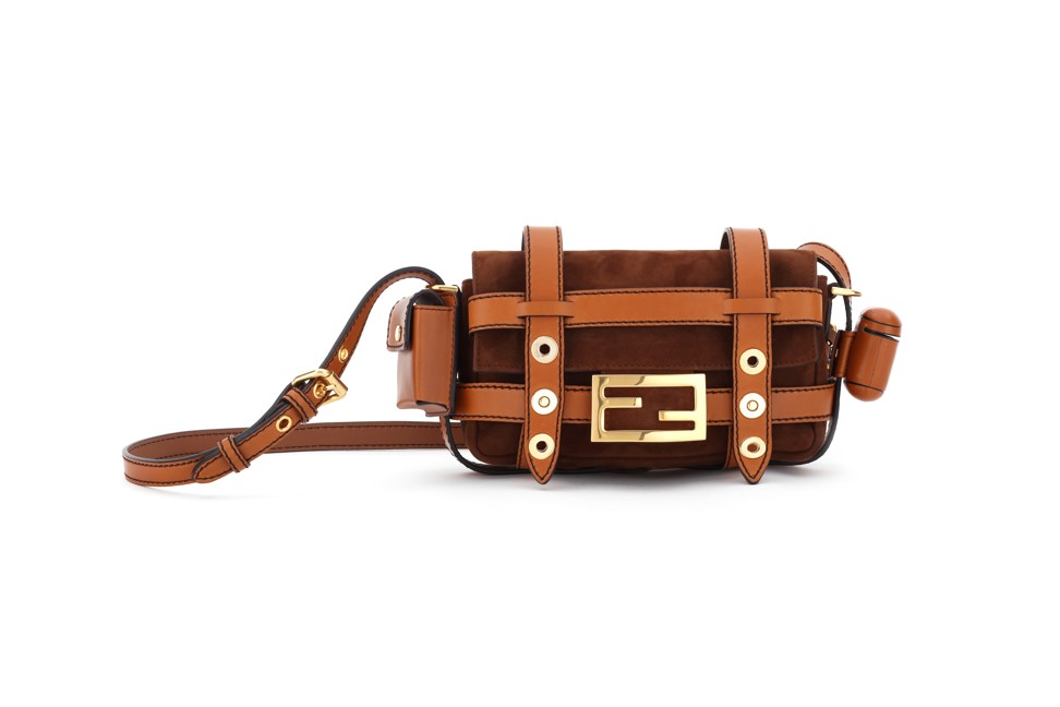 The small version of Fendi’s classic Baguette bag mixes different shades of brown suede and leather.