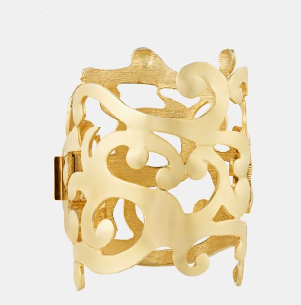 A seven-inch-wide gold cuff in a floral pattern, by Ugo Correani for Versace, and owned by Prince, is priced at US$12,850. Photo: Handout