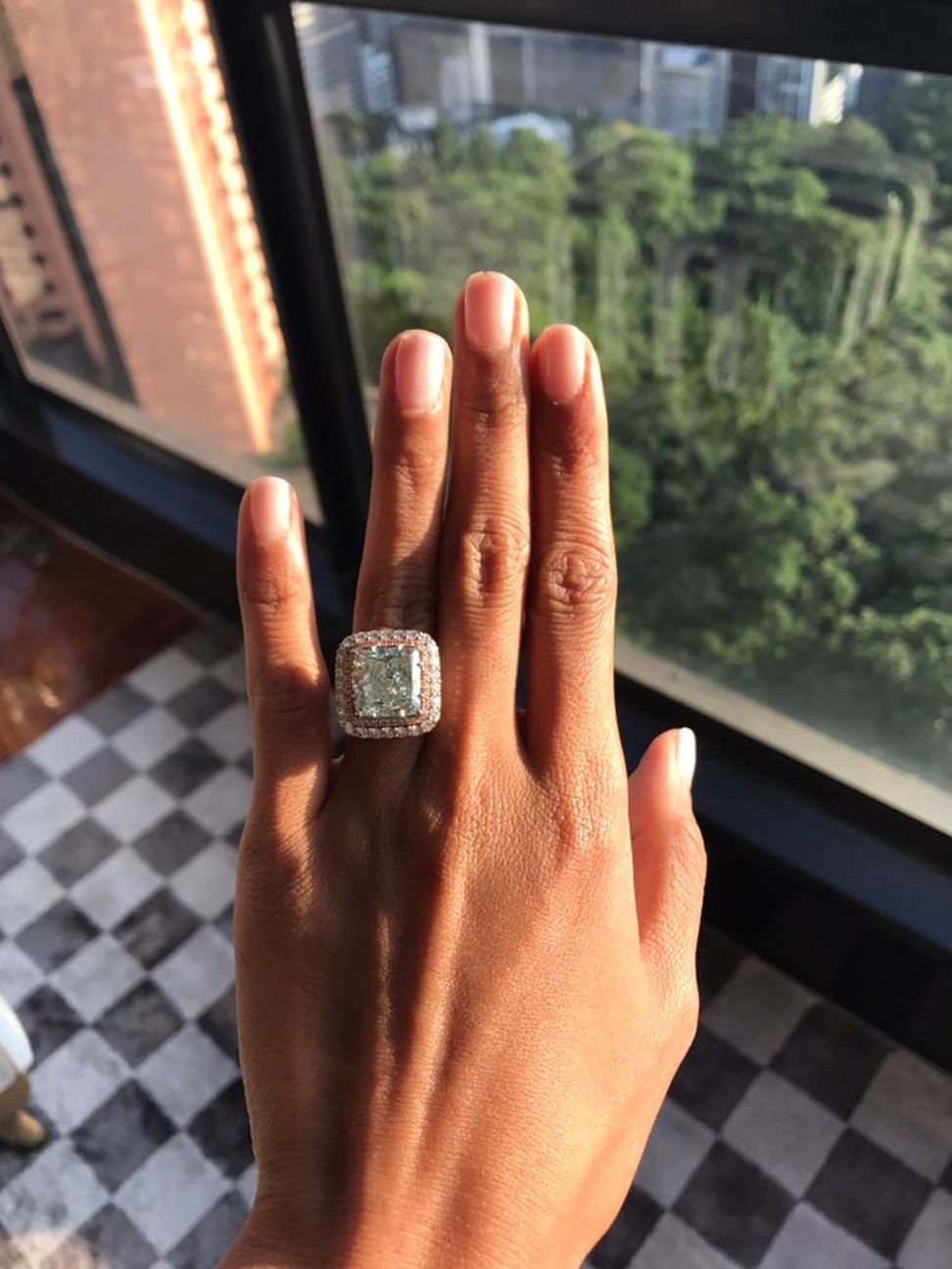 Azura shows off a diamond ring on social media.