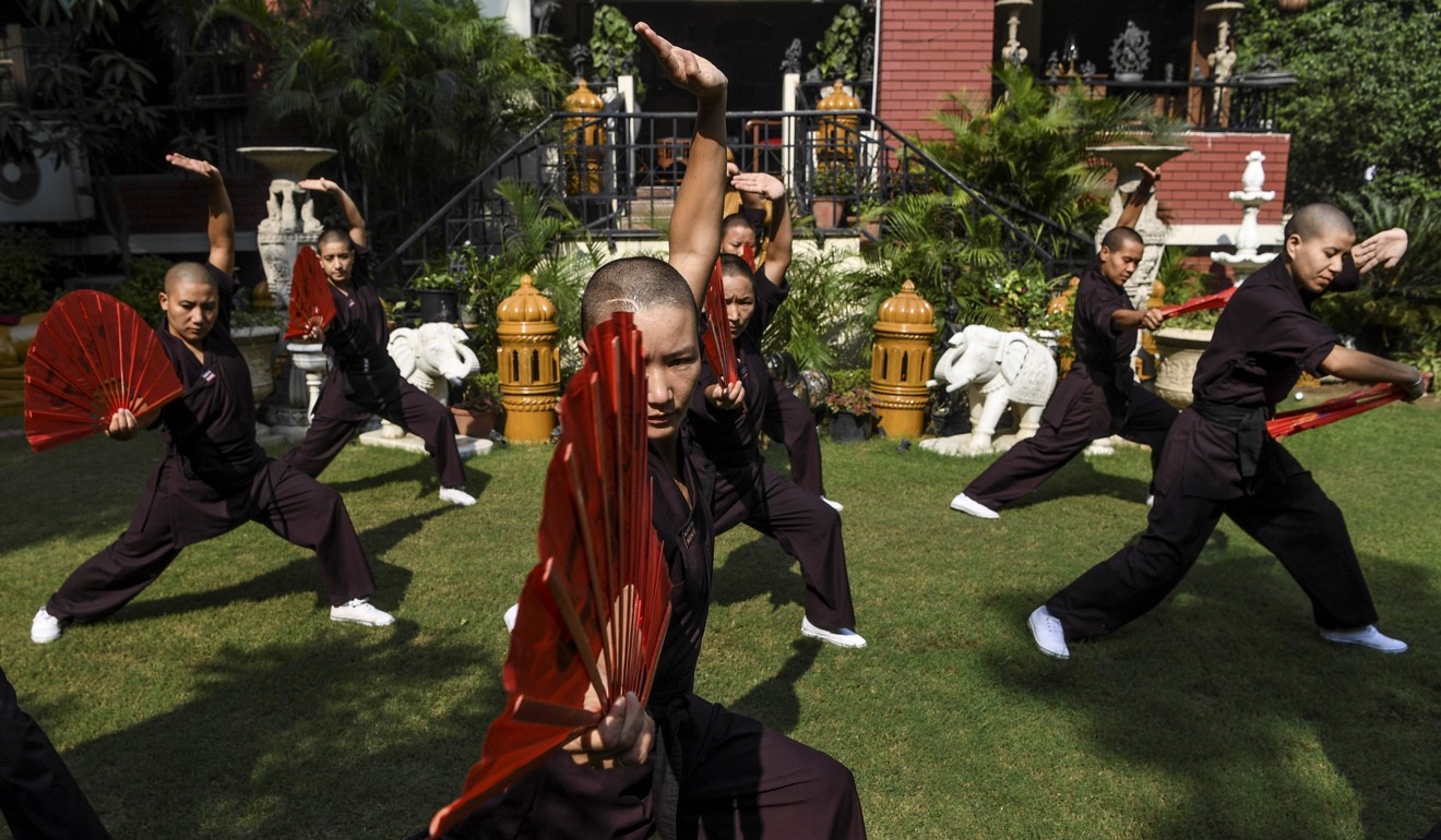 Members of the Kung Fu Nuns group demonstrate their skills in New Delhi. Photo: AFP