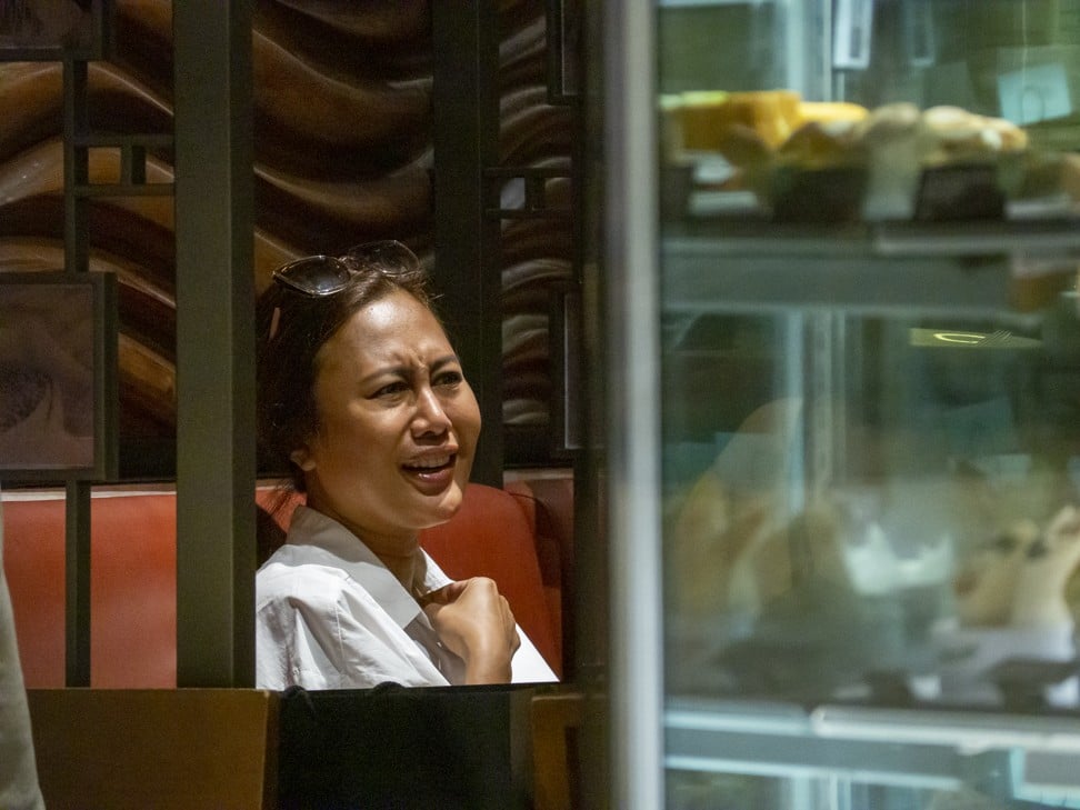 Azura talks to writer Suzanne Harrison in a cafe in Central on September 27. Photo: Antony Dickson