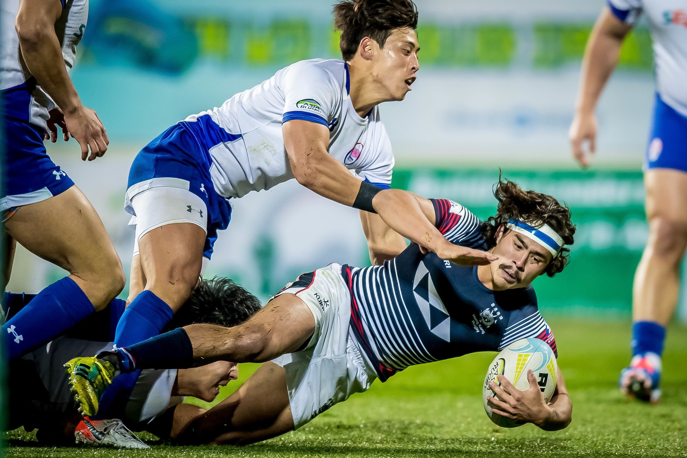 Russell Webb taking on South Korea. He was injured in the first half of the final. Photo: HKRU