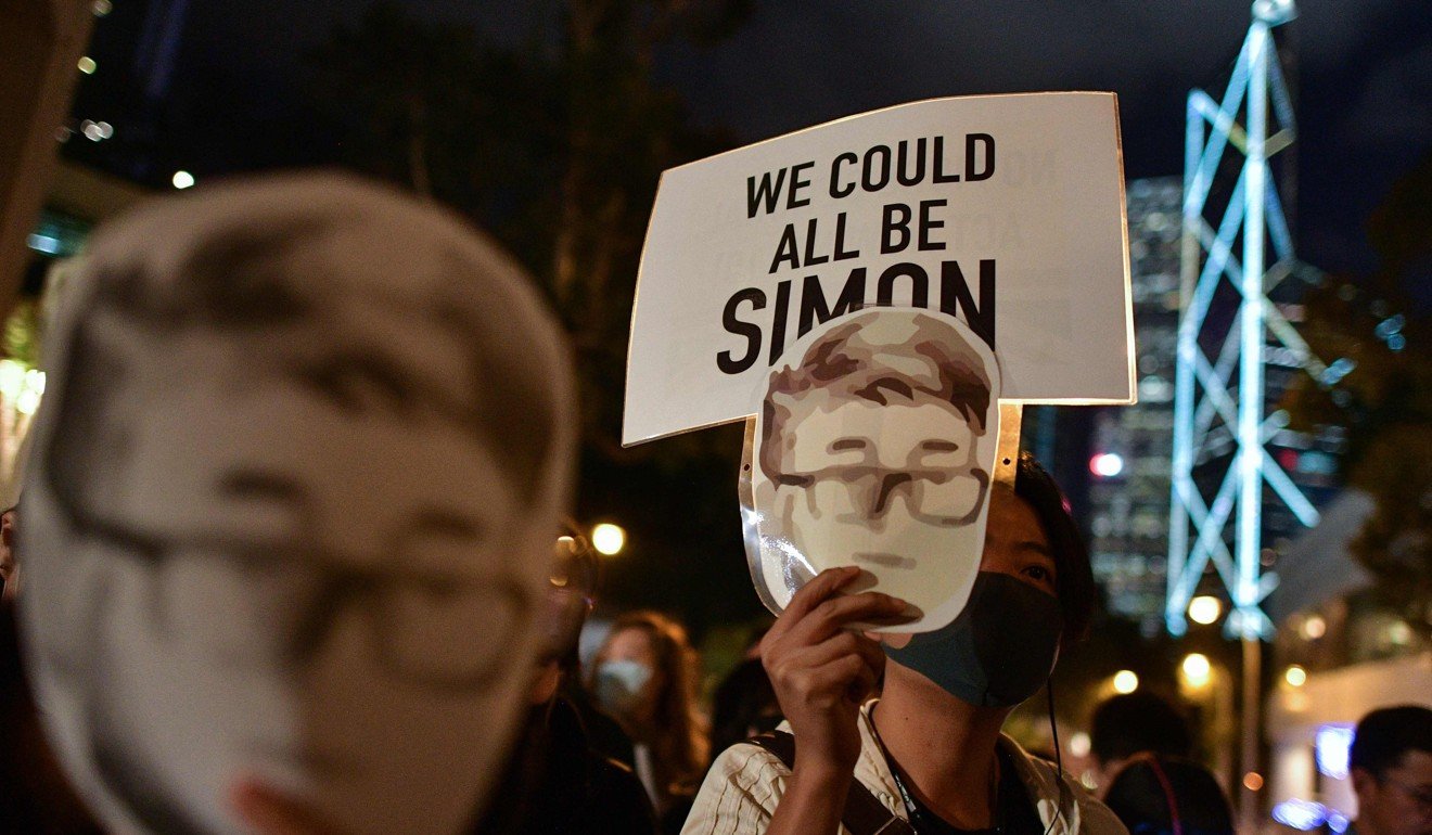 A masked protester said she wanted Britain to pass legislation similar to the US’ Hong Kong Human Rights and Democracy Act. Photo: AFP