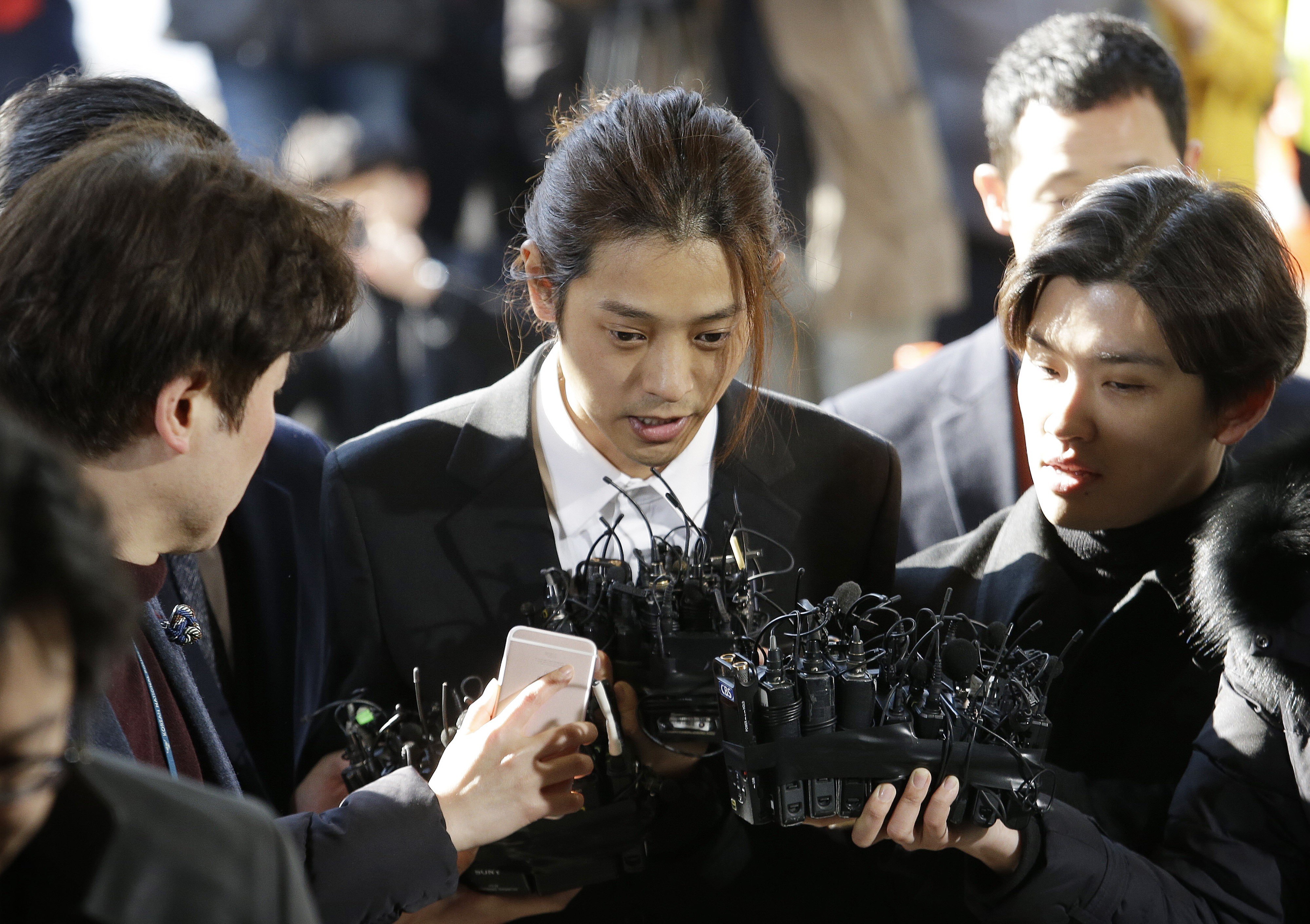 K-pop singer Jung Joon-young, pictured here speaking upon his arrival at the Seoul Metropolitan Police Agency in March, received a six-year prison term for gang-raping two different victims on two occasions in 2016, and filming himself having sex with other women without their knowledge and sharing the footage without their consent. Photo: AP